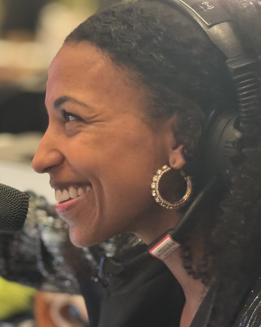 Chelsea smiling on headset at the Wells Fargo Live Voice MC desk