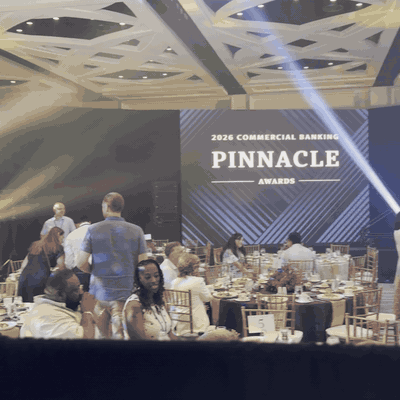 Looping clip: the view pans across a packed Wells Fargo awards ballroom to Chelsea calling the show from her booth