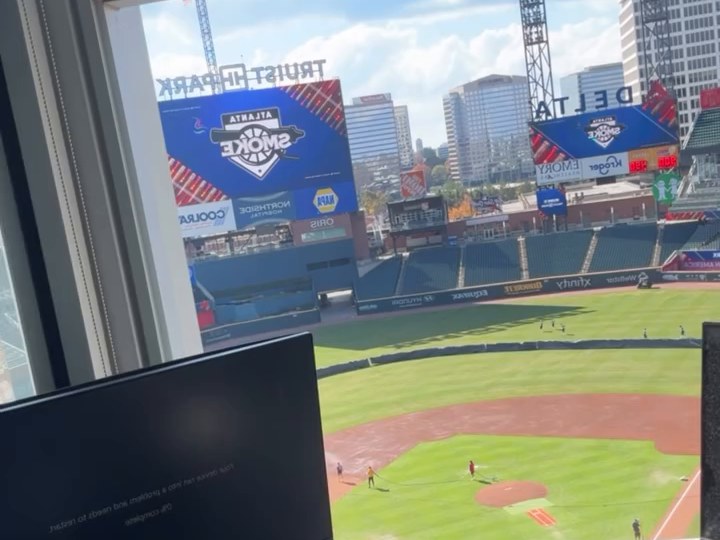 The view from the PA booth at Truist Park, with Atlanta Smoke on the scoreboard