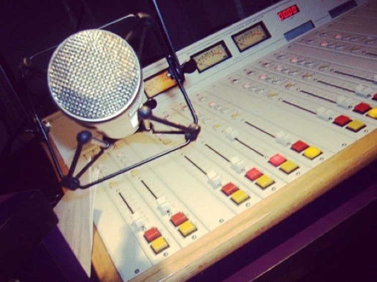 A broadcast mixing console and studio mic